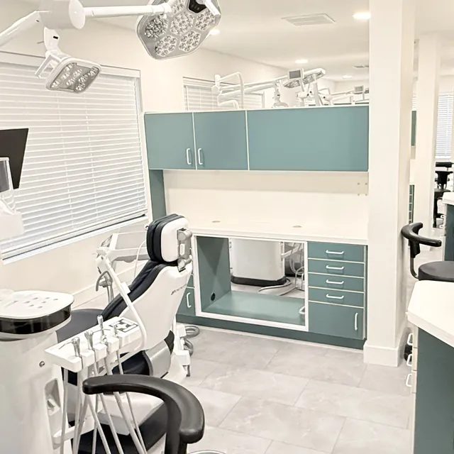 Surgical treatment room with dental chair and overhead lights at Aloha Dental Specialty Center in Beaverton